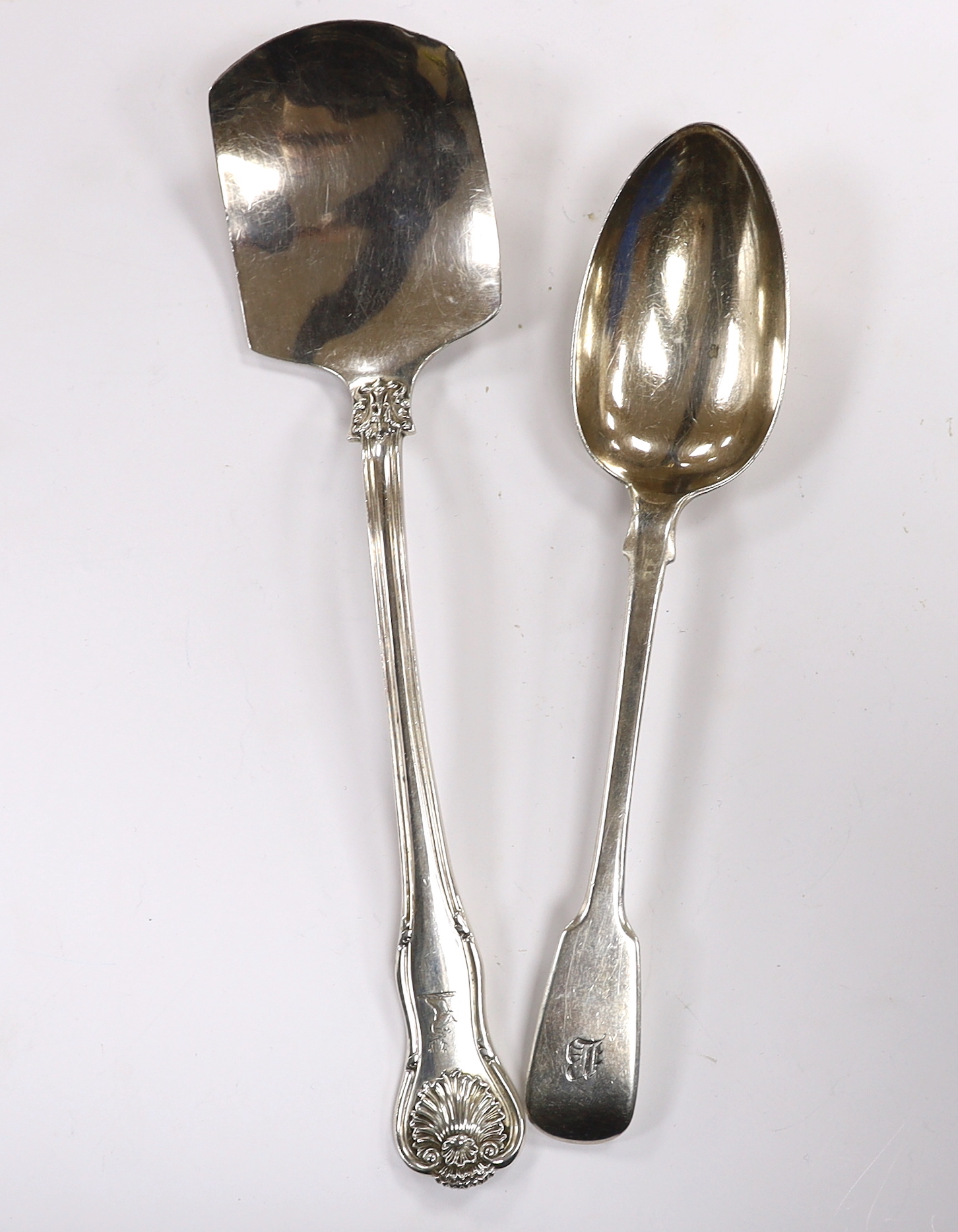 A William IV silver shell pattern server by Mary Chawner, London, 1835 and a similar fiddle pattern table spoon, London, 1834, 7.8oz.